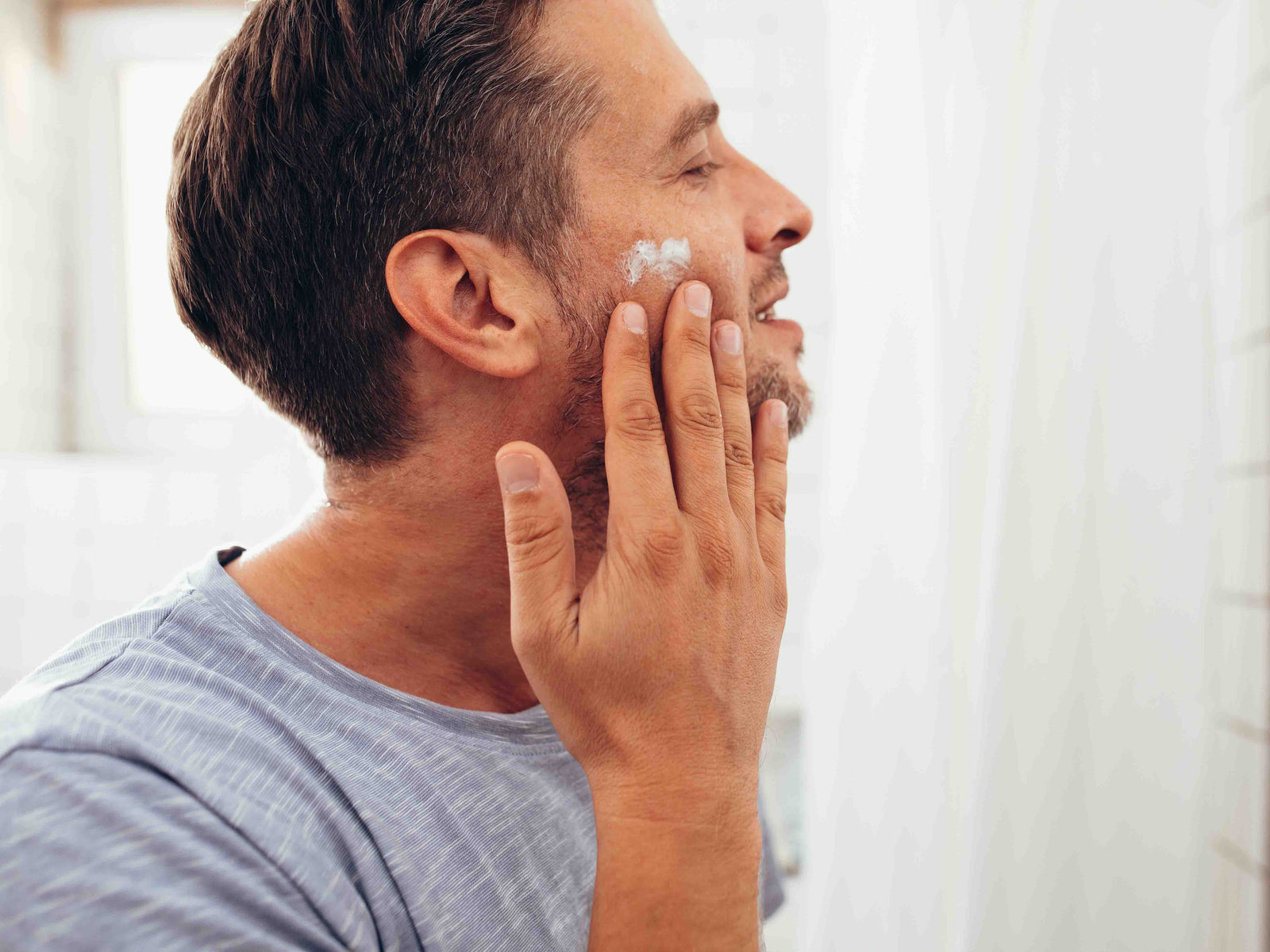 Man applying shaving cream