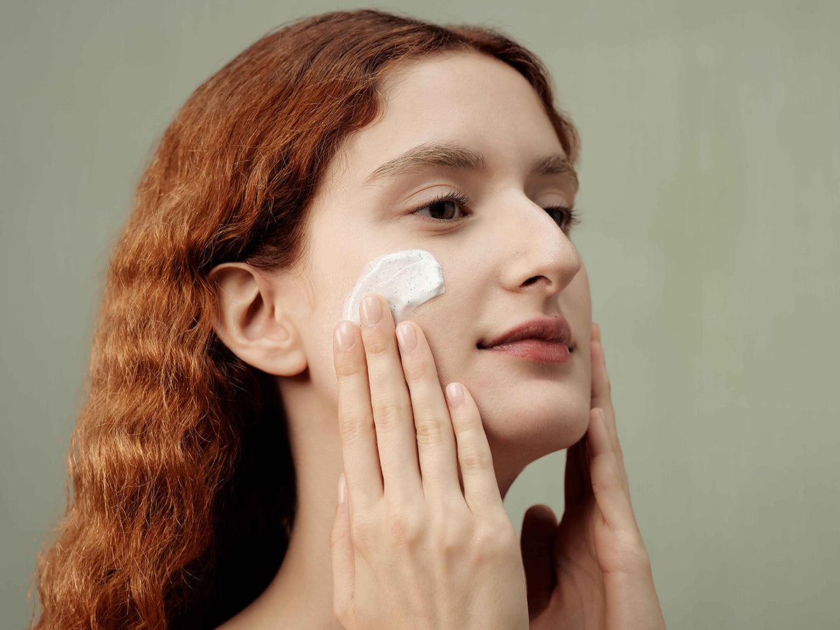 woman applying face cream